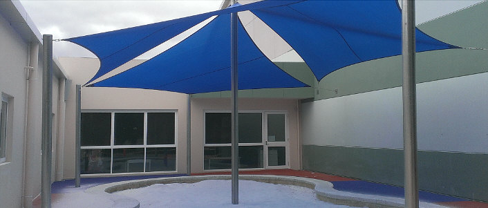 Shade sails over swimming pool area image
