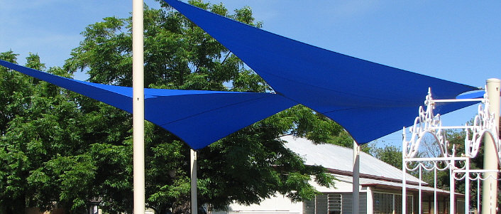 Twin blue sails over garden image